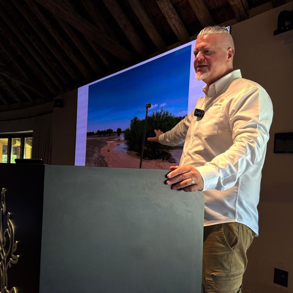 Speaker presenting ecological infrastructure development strategies during Desert Group's technical tour at Sharjah Safari.
