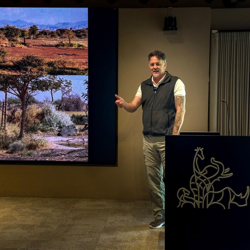 Expert speaker discussing ecological engineering and landscape resilience during the Sharjah Safari technical tour.
