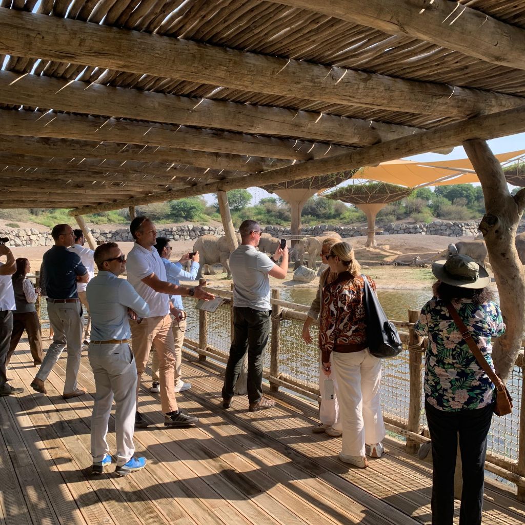 Industry professionals participating in Desert Group's ecological infrastructure technical tour at Sharjah Safari, observing integrated habitat and water management systems.